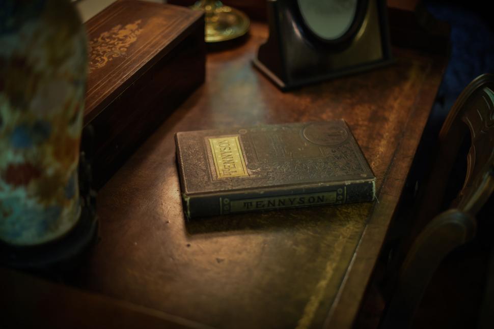 Free Image of Vintage Tennyson book on a wooden desk close-up 