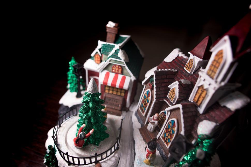 Free Image of Charming snow-covered miniature village with decorations 