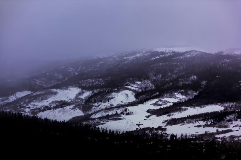 Free Image of Partially snow-covered mountains on a winter morning. 