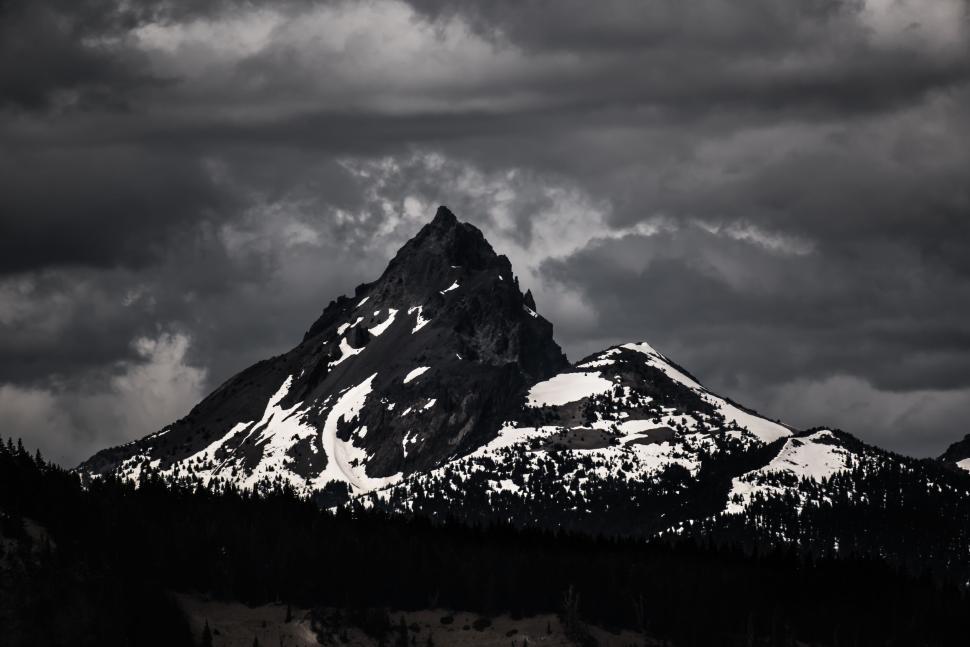 Free Image of Towering rugged snow-capped mountain against sky 