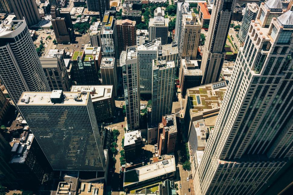 Free Image of Aerial view of city skyscrapers and street grid in broad daylight. 