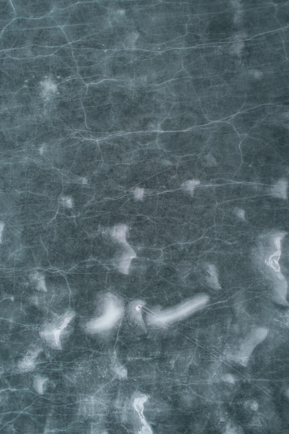 Free Image of Abstract Aerial View of Cracked Ice with Blue Hue 