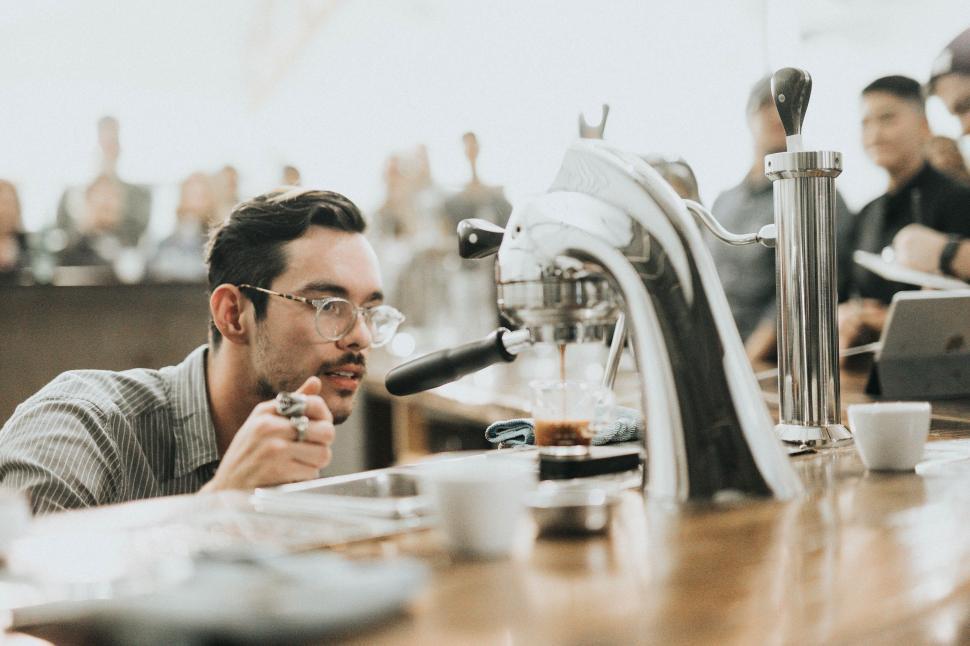Free Image of Barista making coffee with an espresso machine at cafe. 