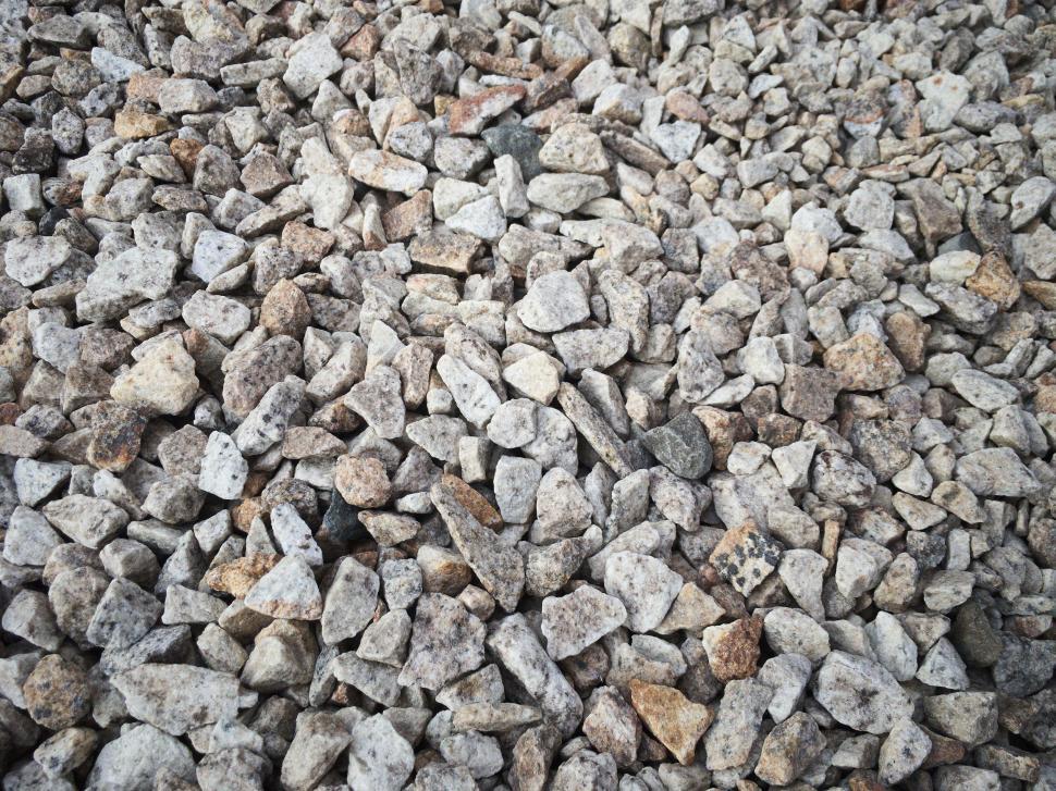 Free Image of Pile of grey and brown rocks with rough textures close-up. 