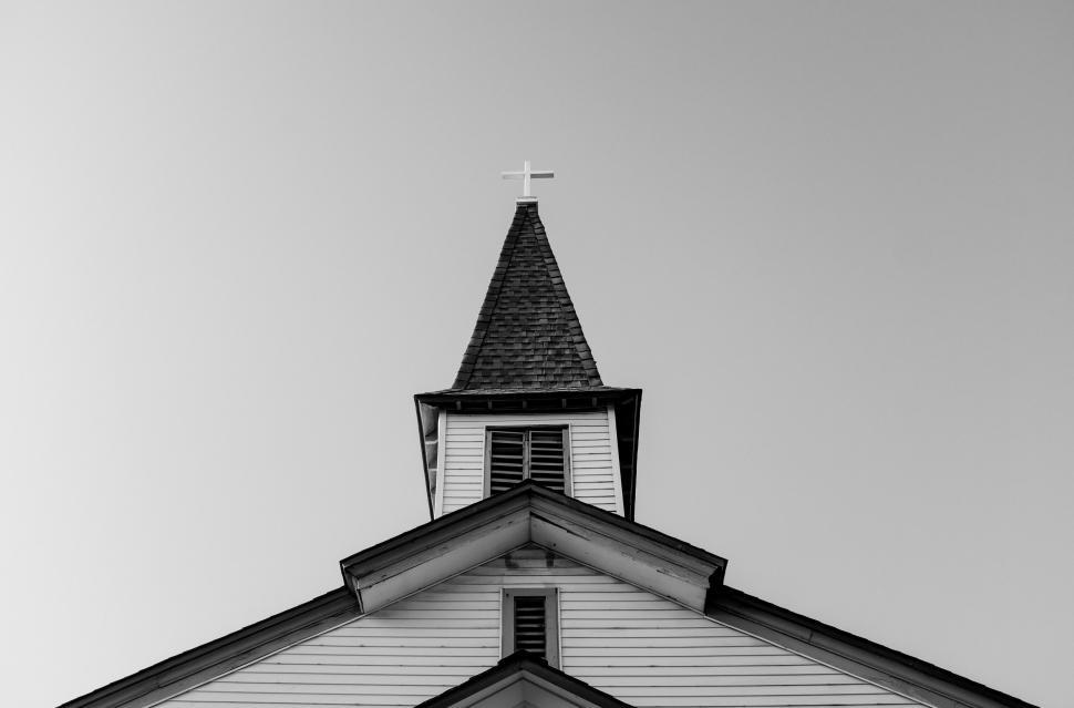 Free Image of Black and white image of a church steeple and cross. 