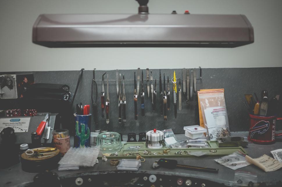 Free Image of A workshop with various tools displayed on the wall. 