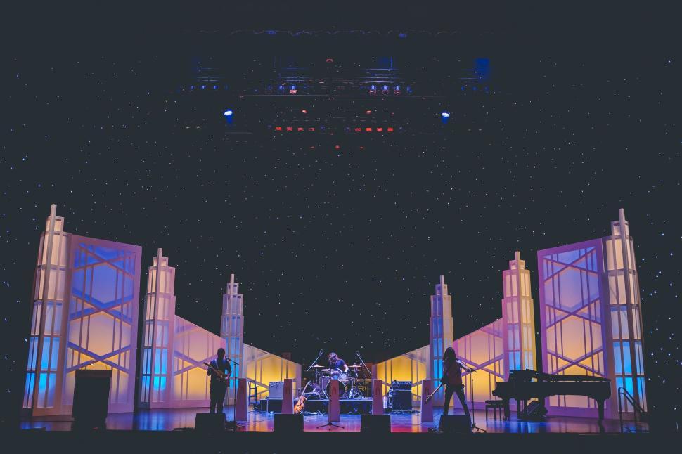 Free Image of Stage with musicians under starry lighting setup 