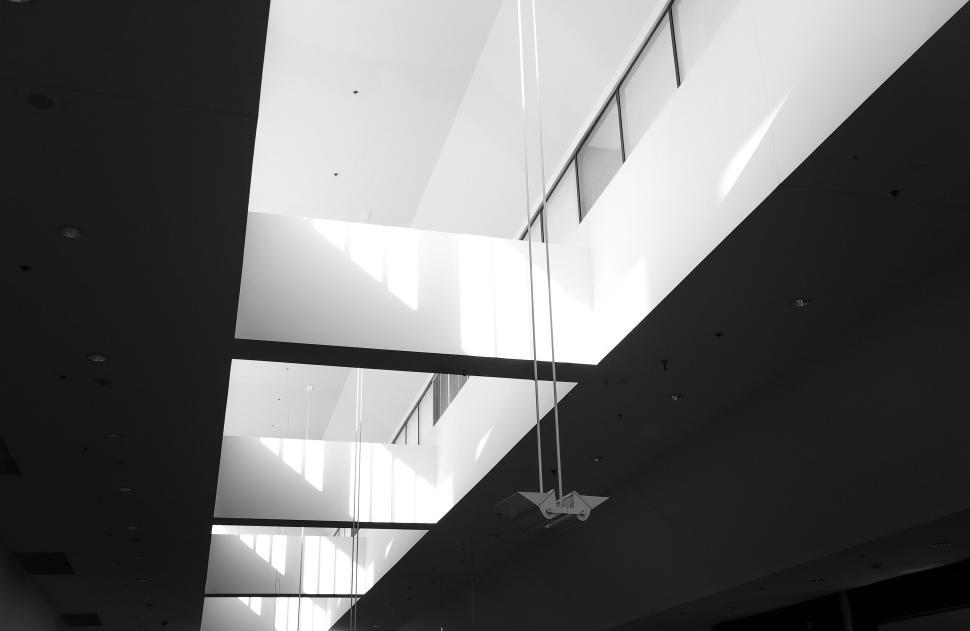 Free Image of Modern architectural ceiling with light streaming in. 