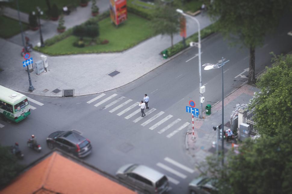 Free Image of Top view of a crosswalk with people crossing street. 