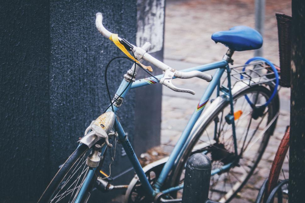 Free Image of Classic vintage bicycle parked on street beside building. 