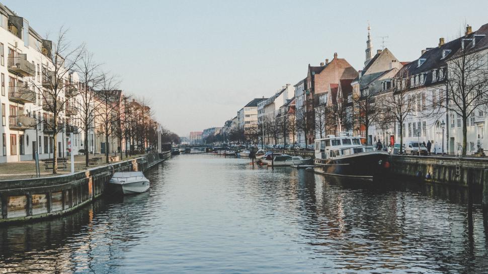 Free Image of Peaceful canal with boats in urban setting at twilight. 