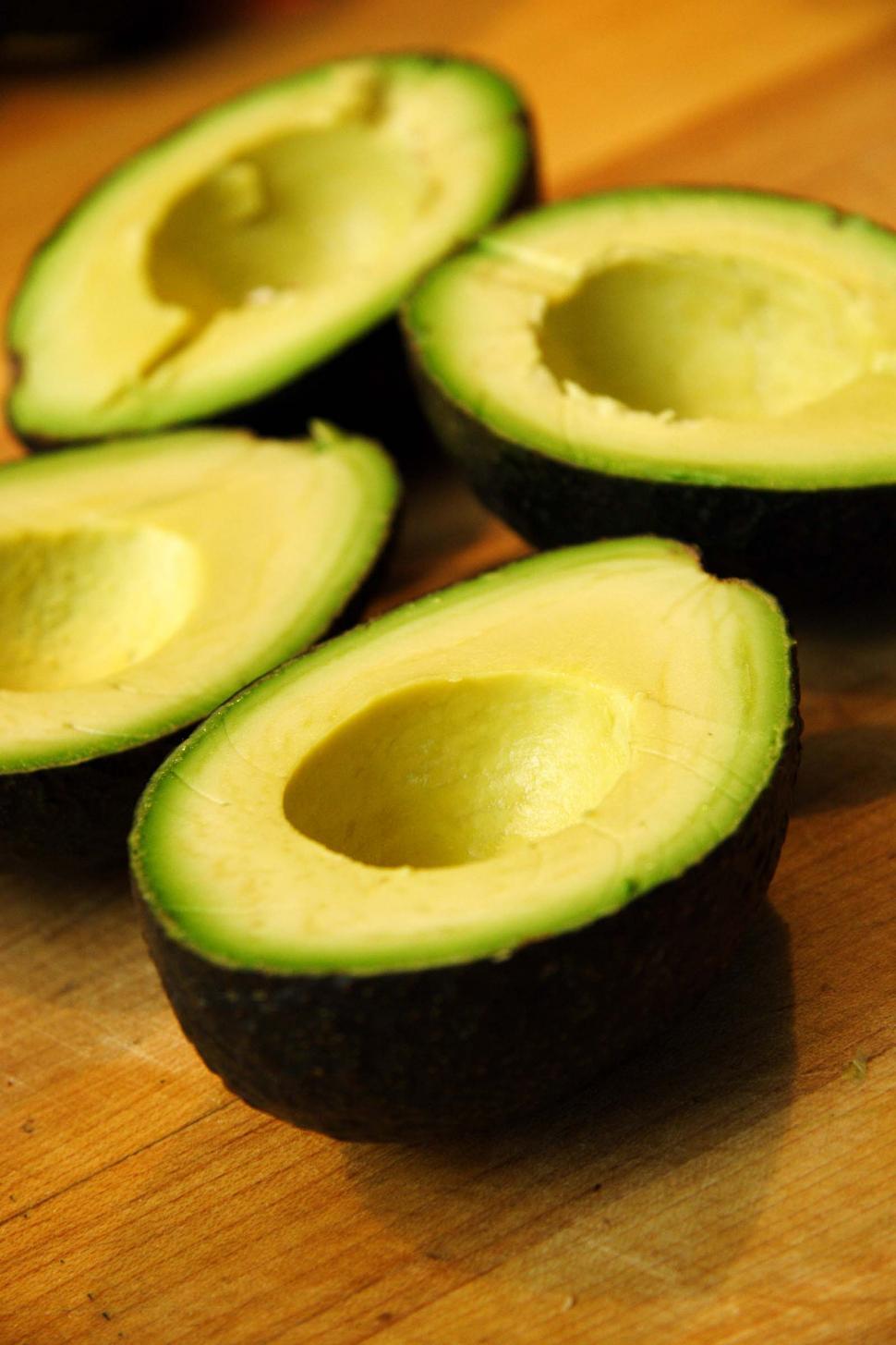 Free Image of Four avocado halves 
