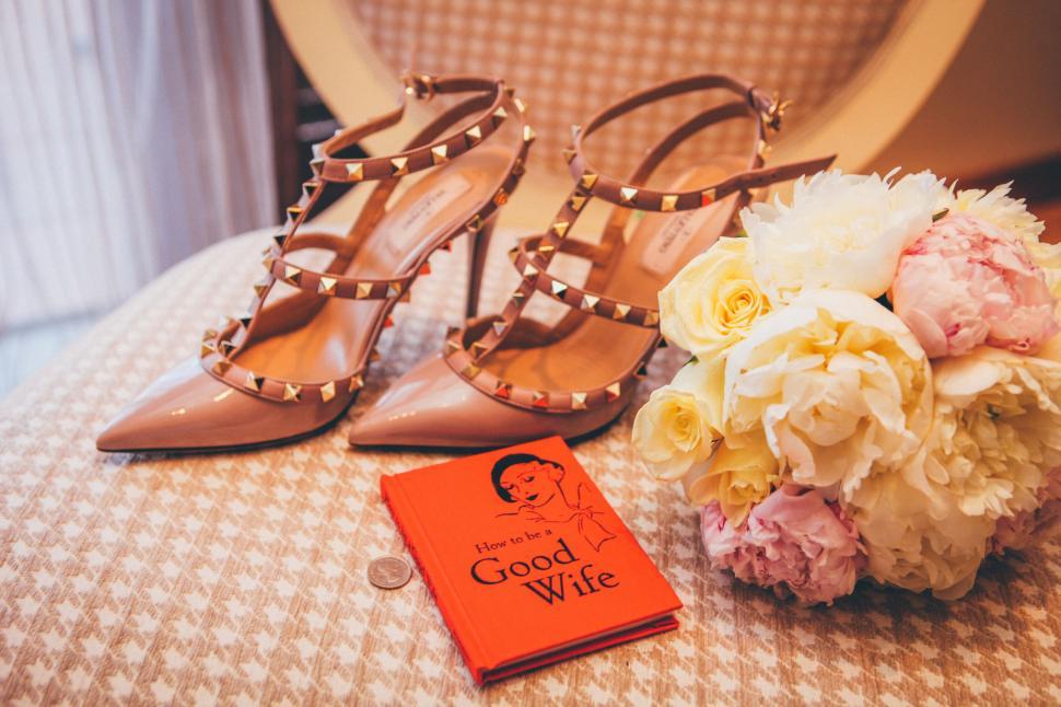 Free Image of Elegant pink high heels with spiked studs on chair 