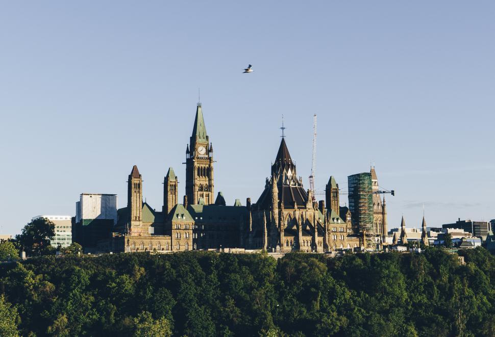 Free Image of Ottawa Parliament Hill historical buildings under blue sky. 