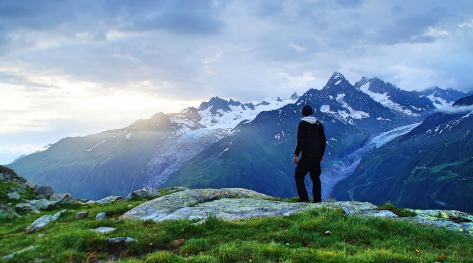 Free Image of Person viewing mountain landscape with snowy peaks 
