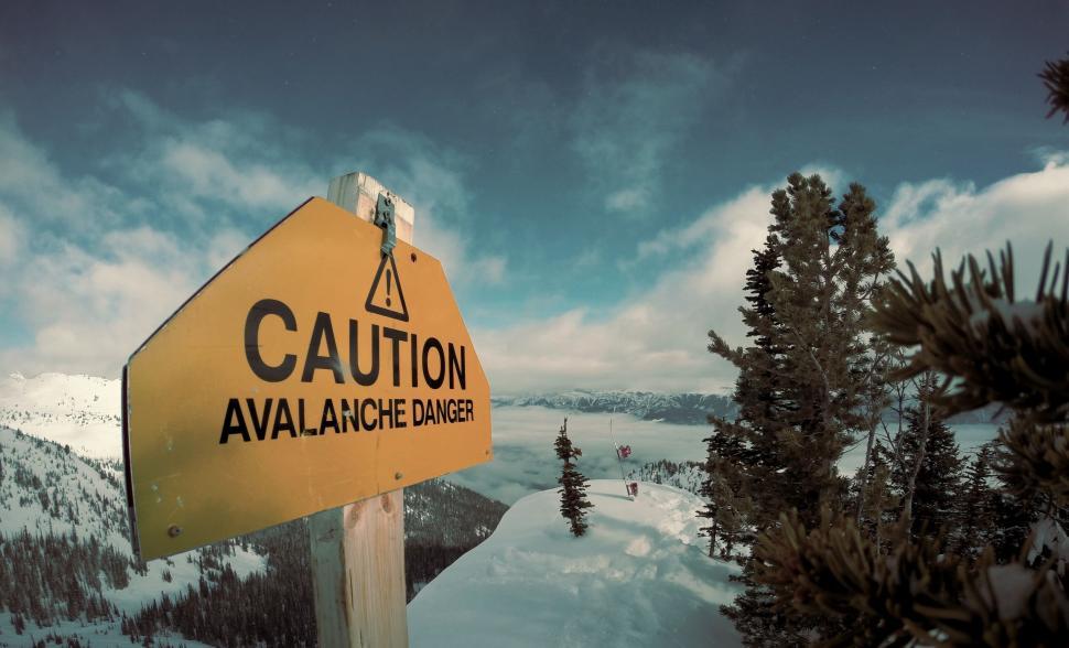 Free Image of Caution avalanche danger sign in snowy mountain area 