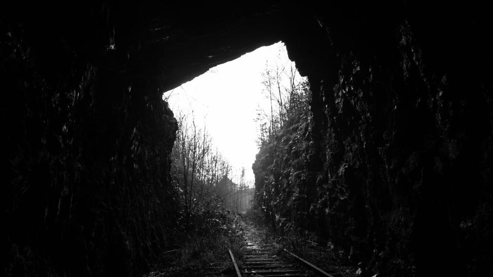 Free Image of Entrance to an old dark abandoned railway tunnel outdoors. 