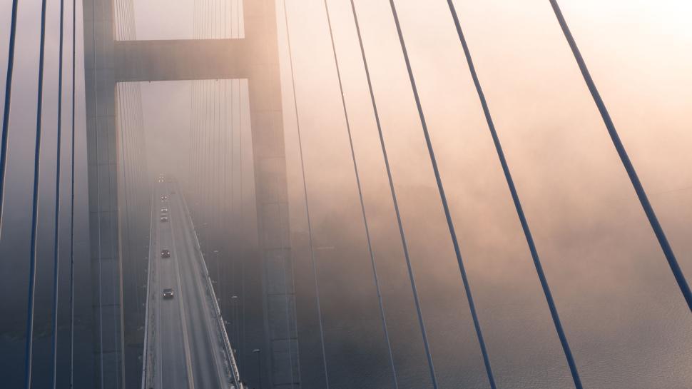 Free Image of Suspension bridge in misty weather with cars. 