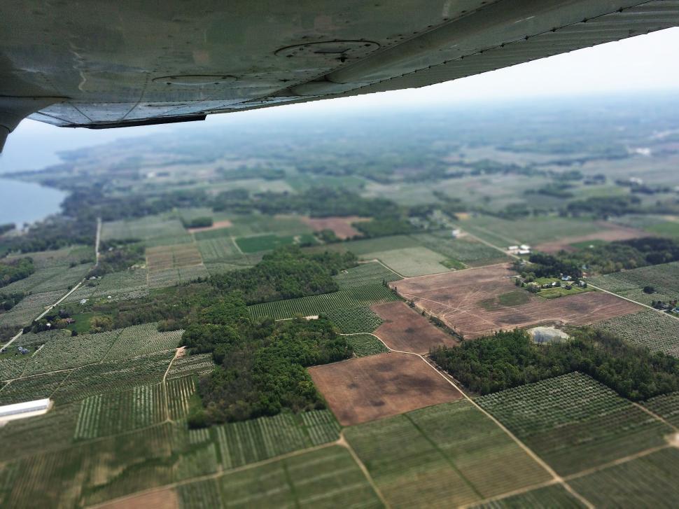 Free Image of Arial view of landscape with fields and forests 