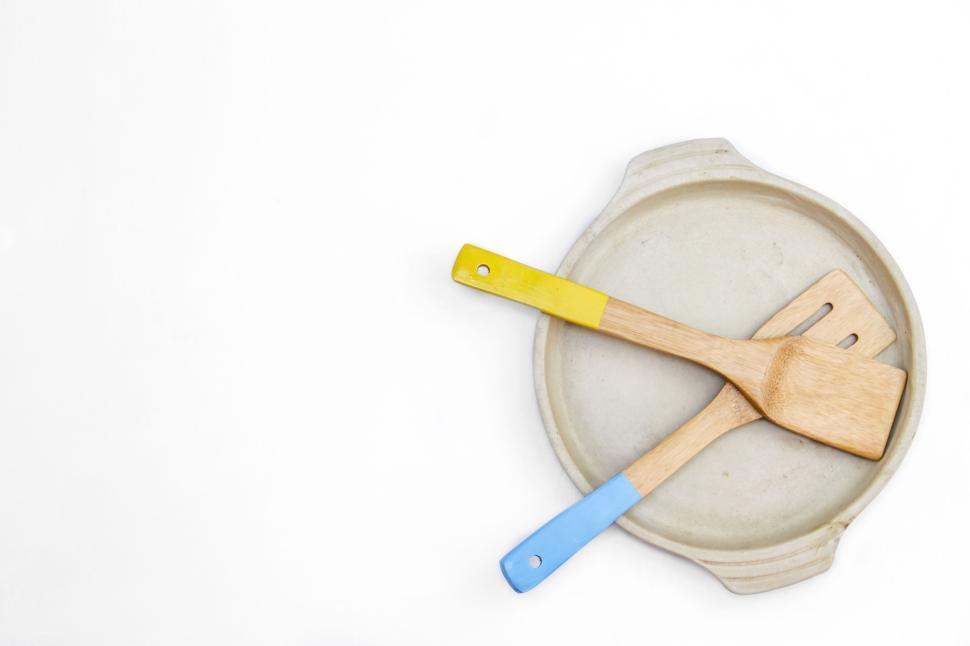 Free Image of Colorful wooden utensils on ceramic plate 