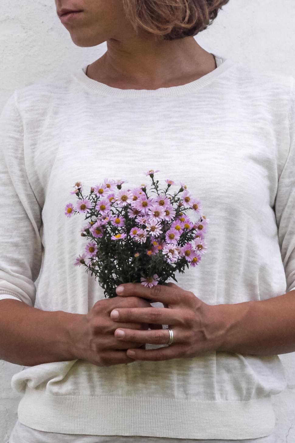 Free Image of Person holding bouquet of pink and purple flowers 