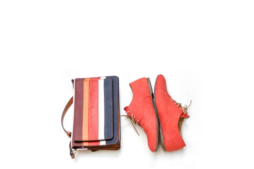 Free Image of Striped bag and red shoes on a white background. 