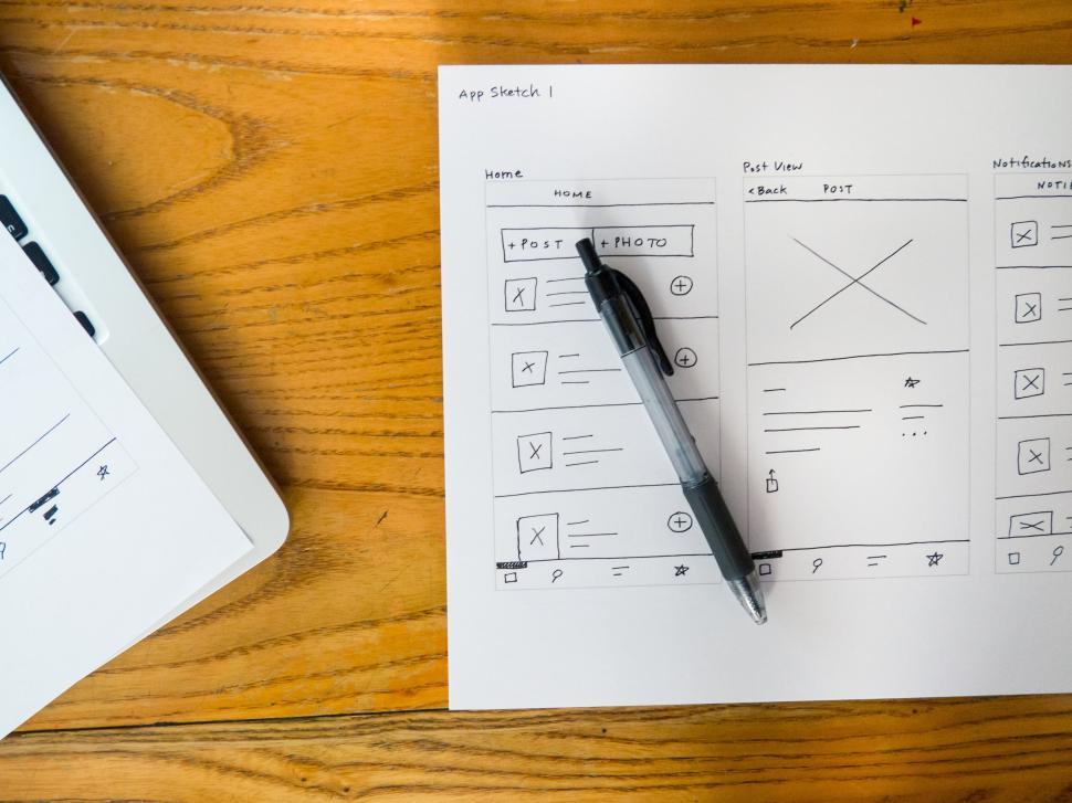 Free Image of Hand-drawn wireframe sketches for a mobile app layout design. 