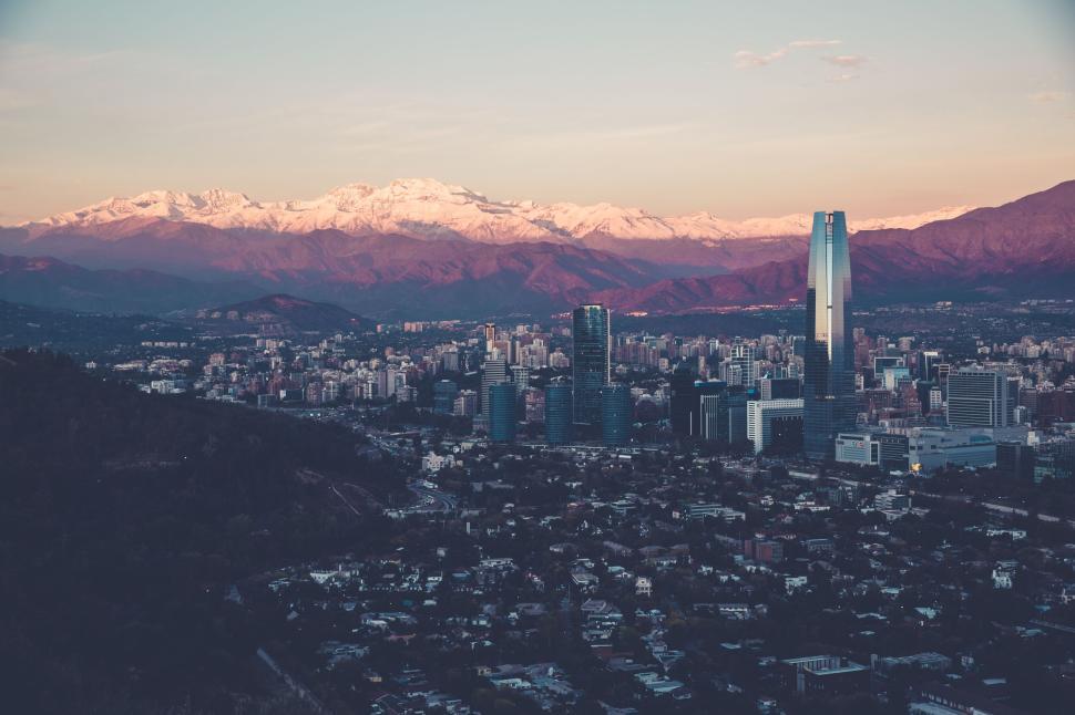 Free Image of Cityscape with mountains in background at twilight time 