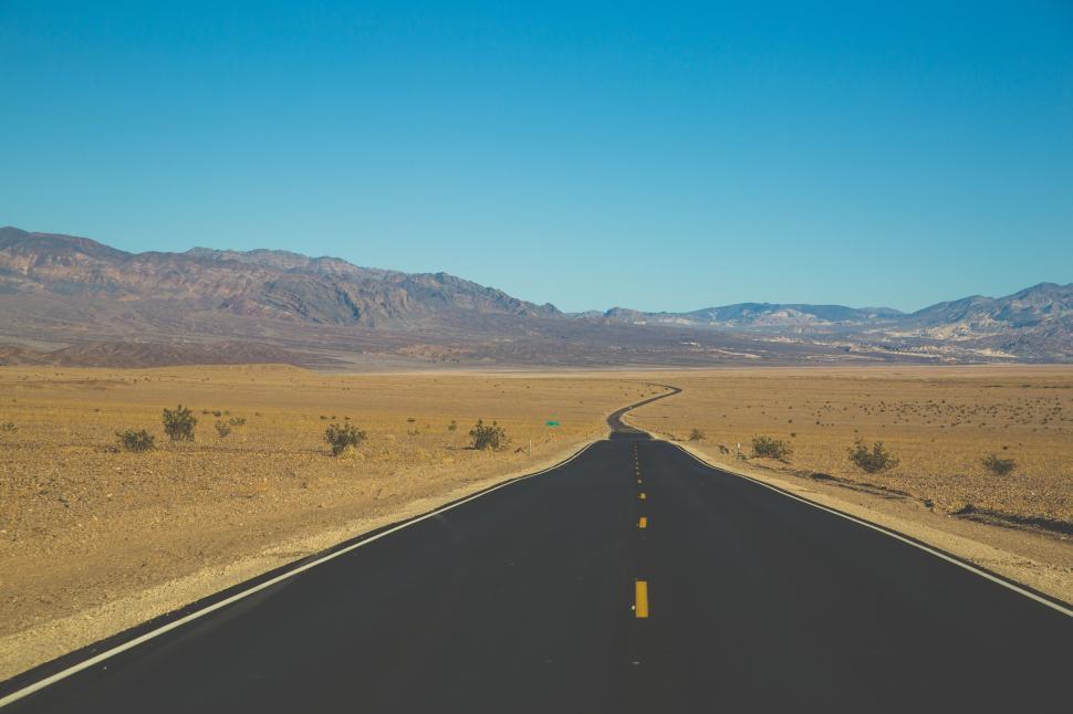 Free Image of Endless road stretching into the desert horizon 