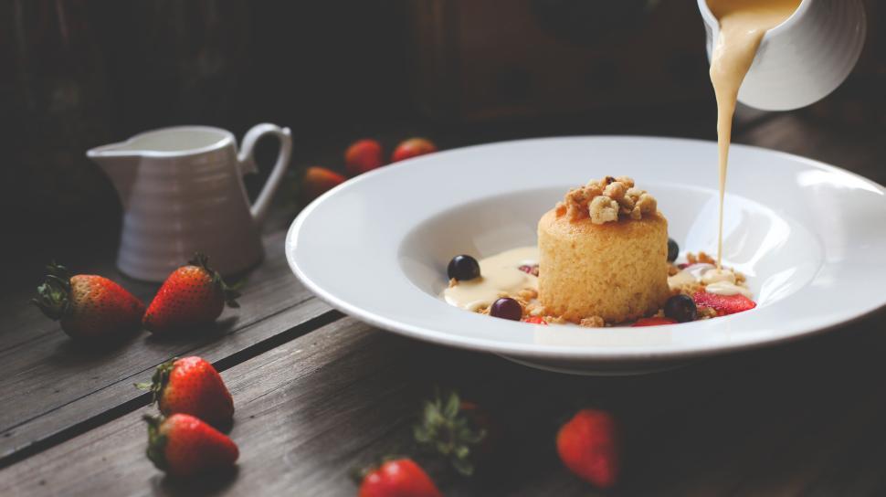 Free Image of Gourmet dessert with cream poured on side plate 