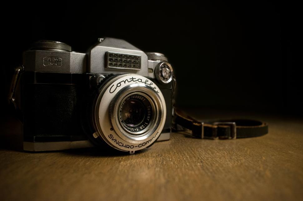 Free Image of Vintage-style Contax camera on wooden surface, nostalgic 