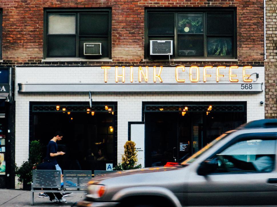 Free Image of Street view of cozy coffee shop named Think Coffee 