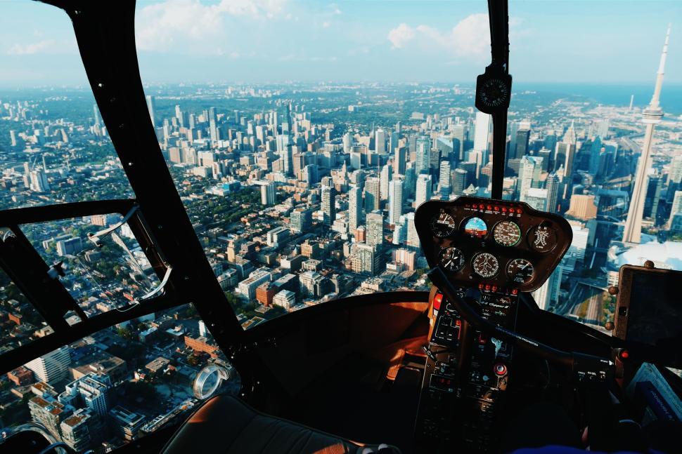 Free Image of Aerial view of city skyline and skyscrapers from helicopter. 