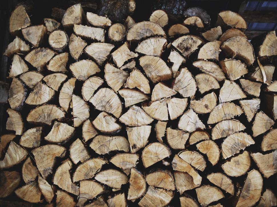 Free Image of Neatly stacked firewood showcasing natural patterns in log. 