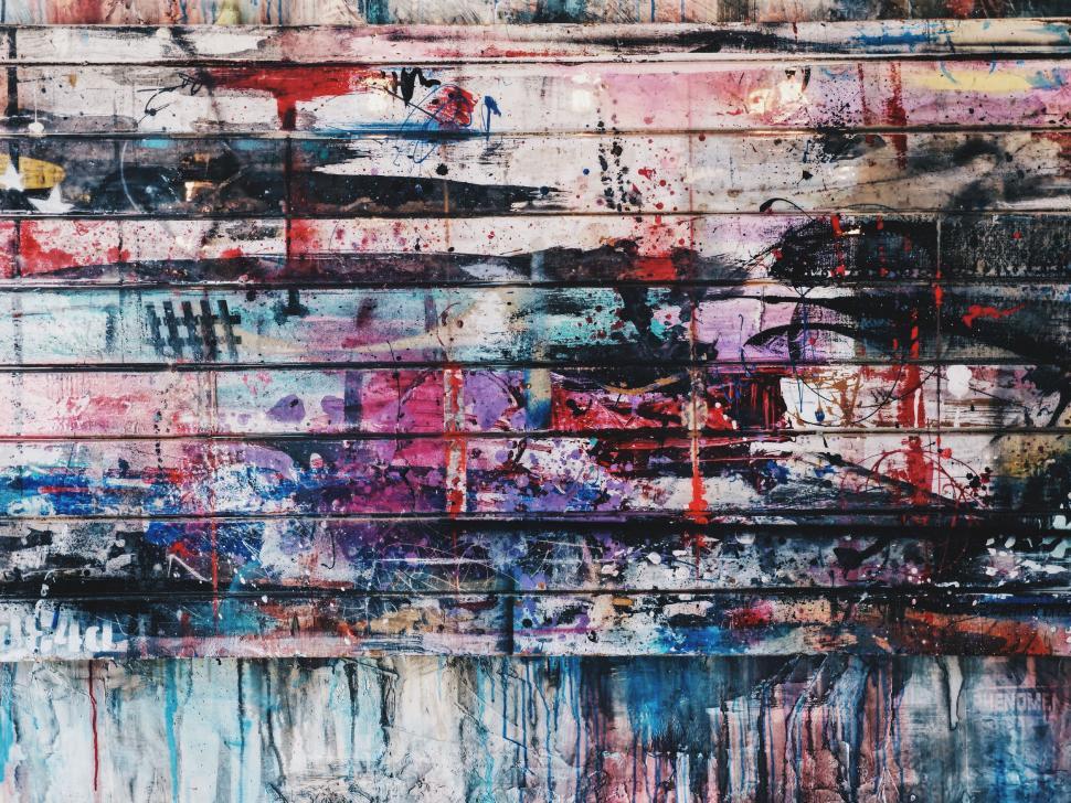 Free Image of Abstract graffiti art with colorful splashes and textures. 