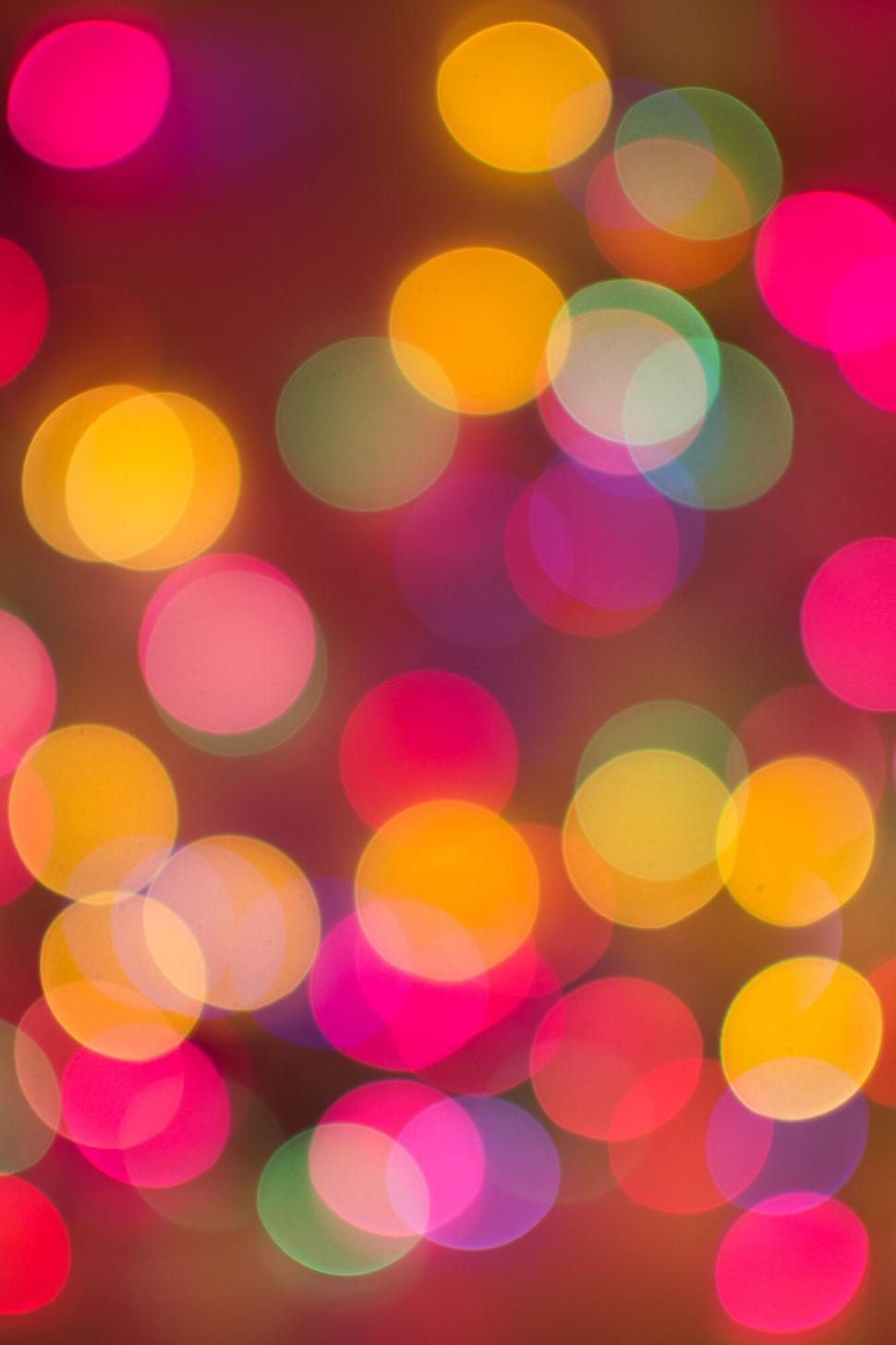 Free Image of Abstract bokeh lights in various colors and sizes. 