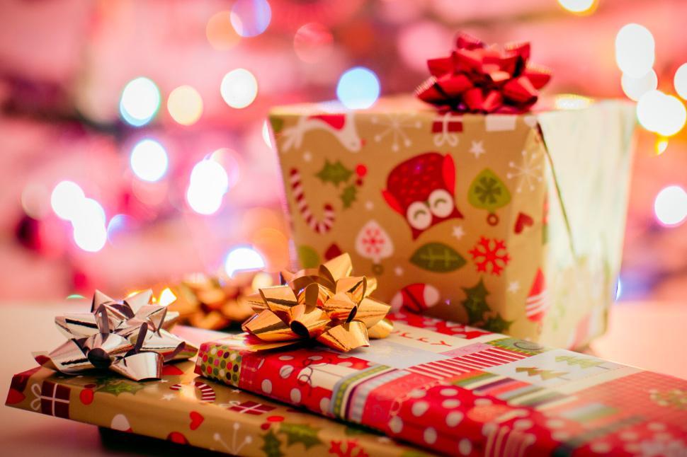 Free Image of Colorful Christmas gift boxes with shiny bows 