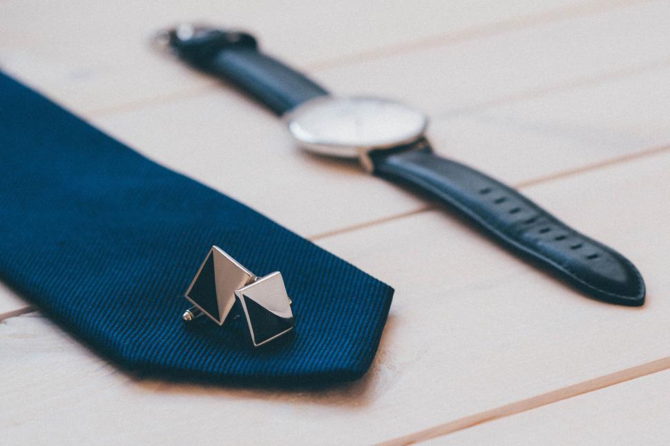 Free Image of Elegant blue tie and stylish watch with cufflinks closeup 