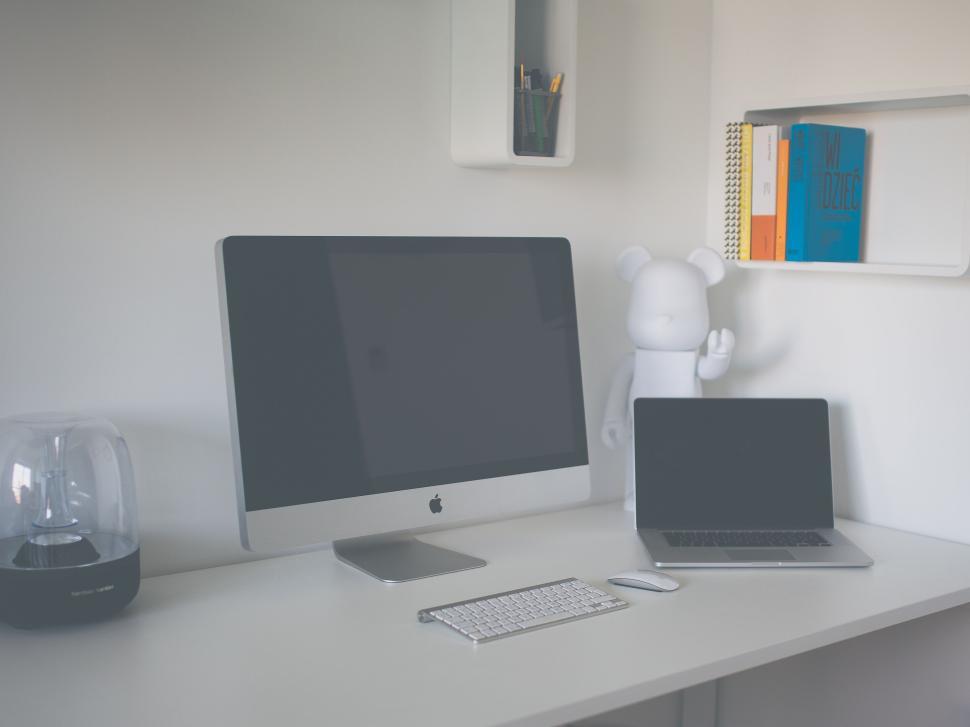 Free Image of Modern workspace with desktop computer and laptop setup 