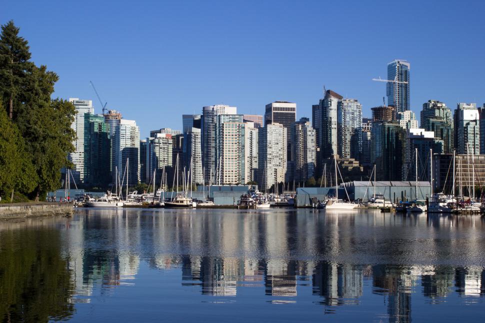 Free Image of Modern city skyline with marina and skyscrapers view 