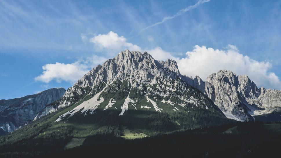 Free Image of Majestic mountain peak standing tall under blue sky 