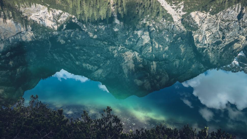 Free Image of Crystal clear reflection of mountain in a blue lake 