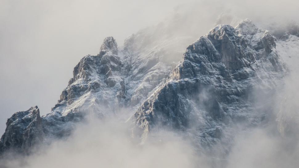 Free Image of Mystic foggy mountains with a snowy landscape view 