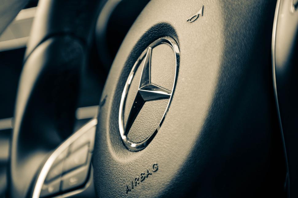 Free Image of Close-up of a Mercedes-Benz steering wheel interior view. 