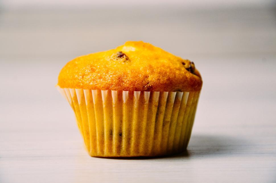 Free Image of Close-up image of a golden muffin on a light background. 