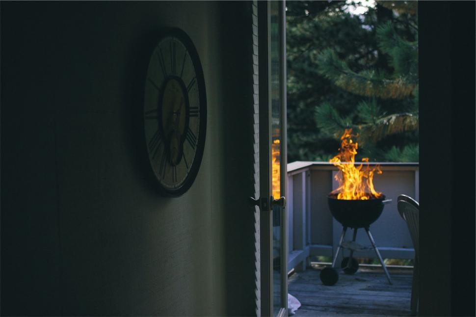 Free Image of House view with a lit barbecue grill in the evening 