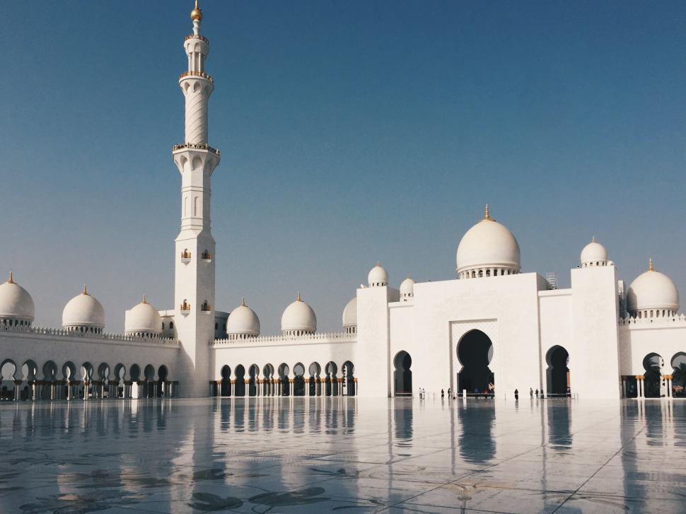 Free Image of Majestic white mosque with domes and minarets on display 