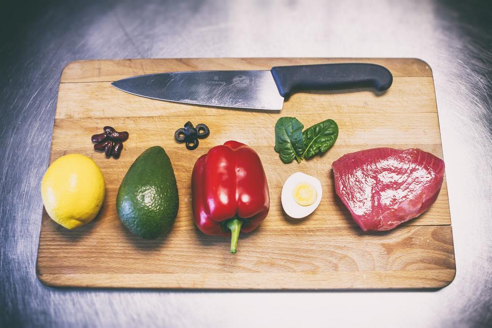Free Image of Cooking ingredients arranged on a wooden board. 