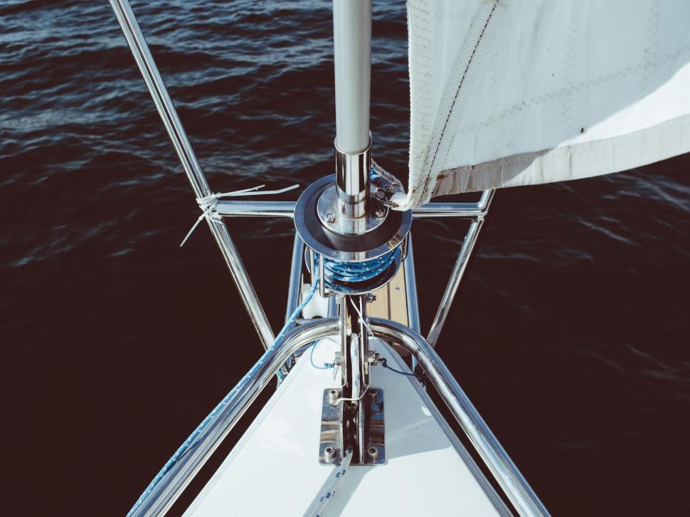 Free Image of Sailboat s bow cutting through calm blue water waves 
