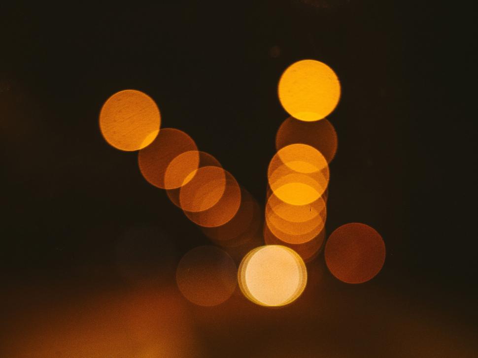 Free Image of Golden bokeh lights creating an abstract V-shape pattern 